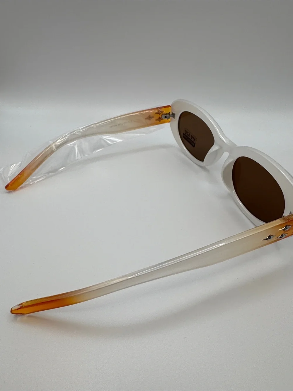 White Oval Sunglasses with Brown Lenses